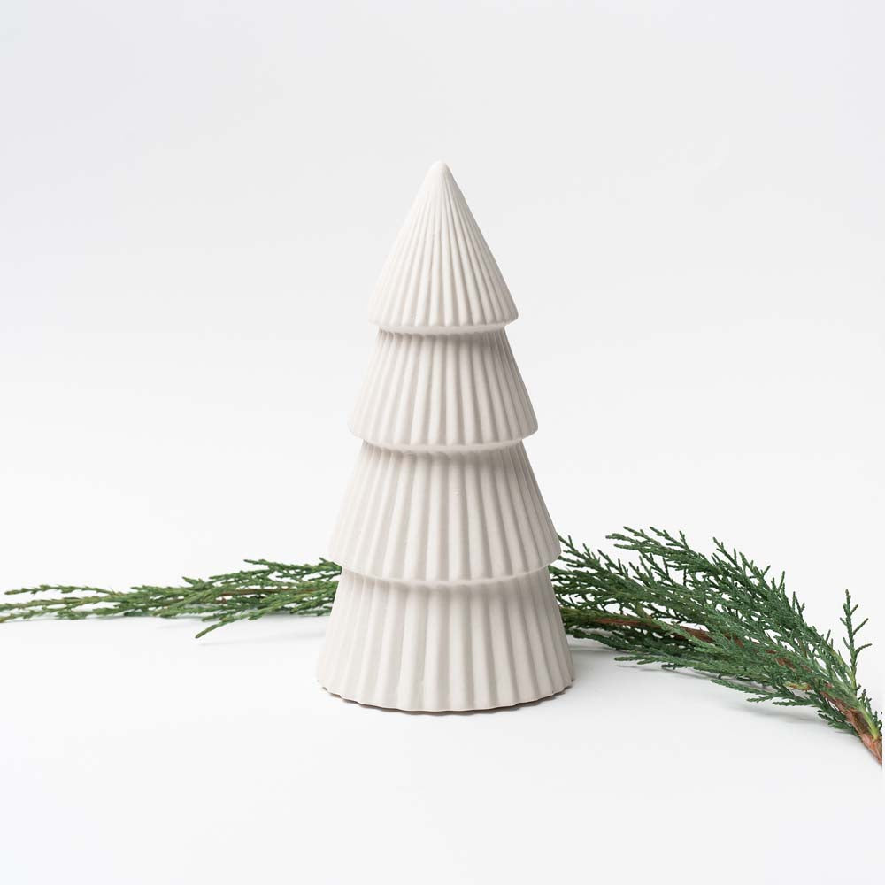 Medium White ceramic decorative Christmas tree on white background