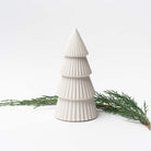 Medium White ceramic decorative Christmas tree on white background