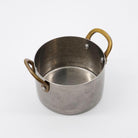 Nicolas Vahé brand metal presentation pot with brass handles on a white background 