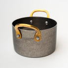 Nicolas Vahé brand metal presentation pot with brass handles on a white background 