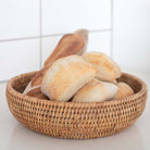 Rattan bowl with bread on a kitchen counter