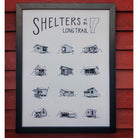 Framed poster of vermont long trail shelters hanging in front of wood