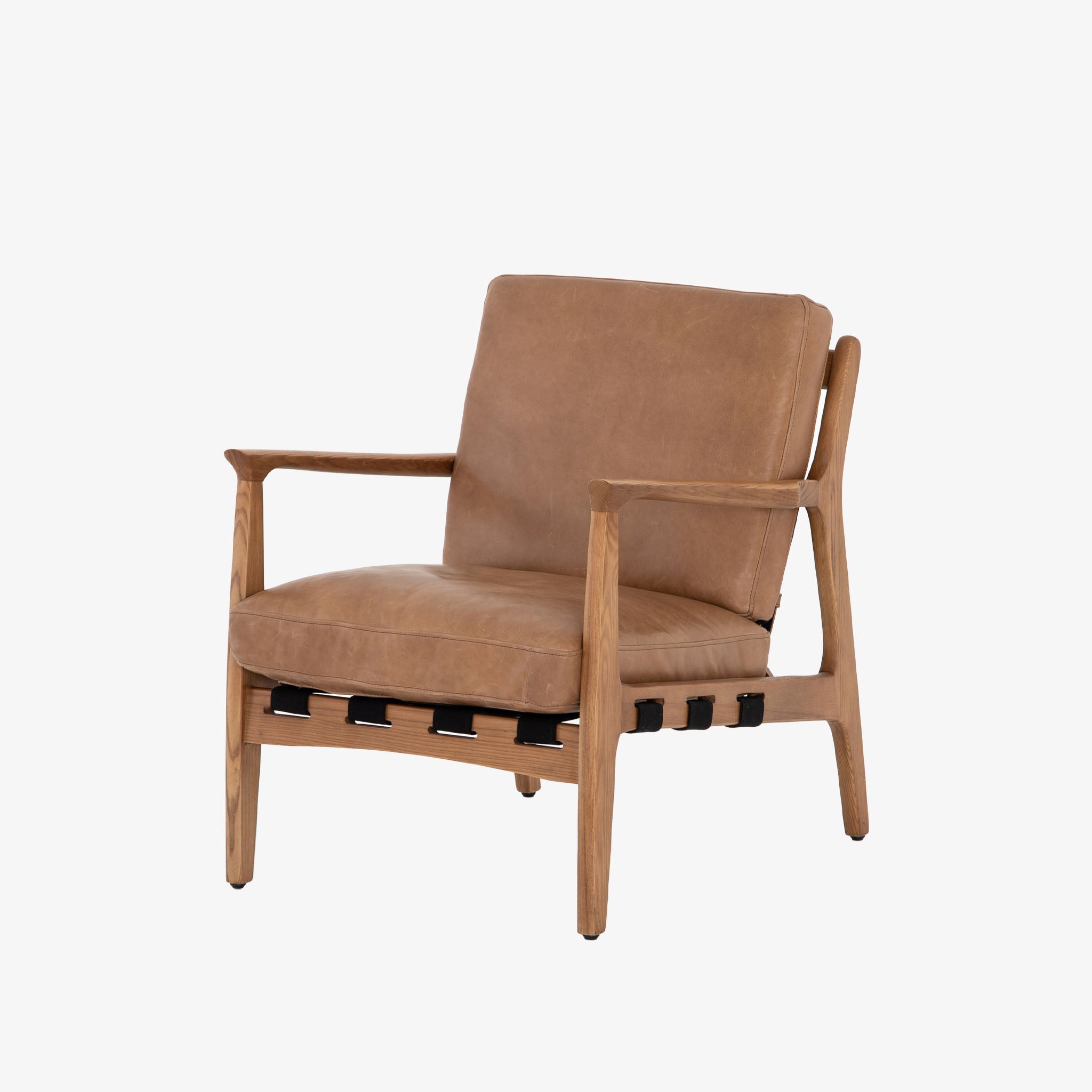 Four hands brand Silas arm chair with wood frame and patina copper leather cushions on a white background