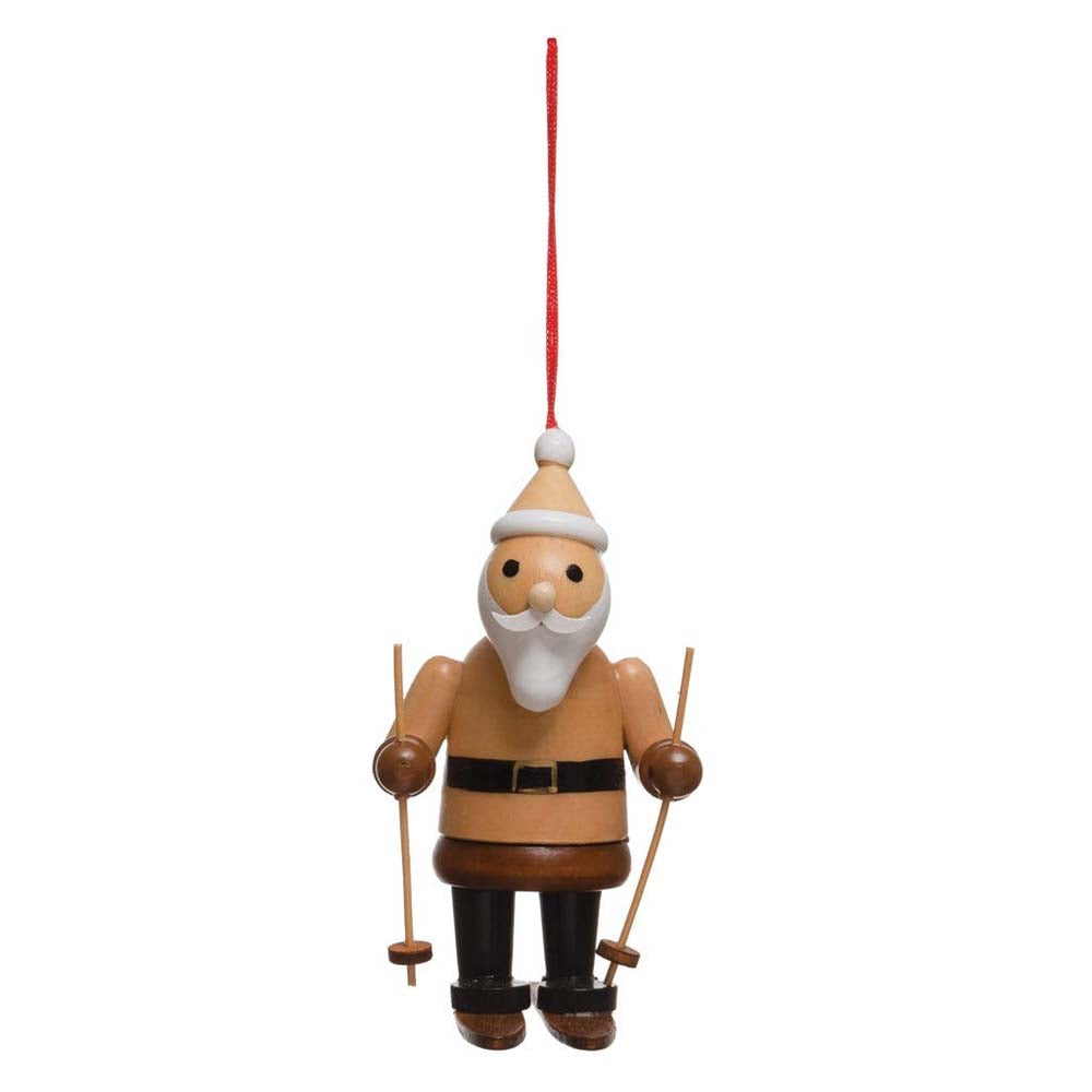 Wood skiing Santa ornament on a white background