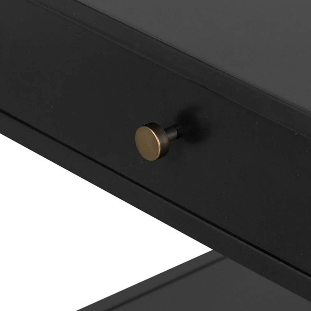 Close up of black single drawer 'Soto' end table by four hands furniture on a white background