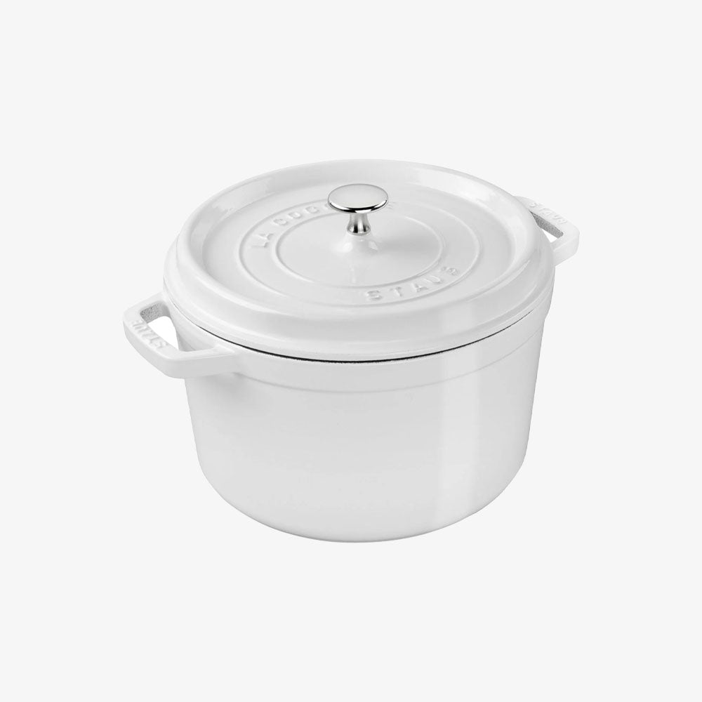 White Staub five quart cast iron dutch oven on a white background