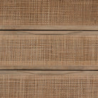 Close up of 'Sydney' Six drawer dresser by Four Hands Furniture with cane drawer fronts and mango wood pulls with black stained mango wood exterior on a white background