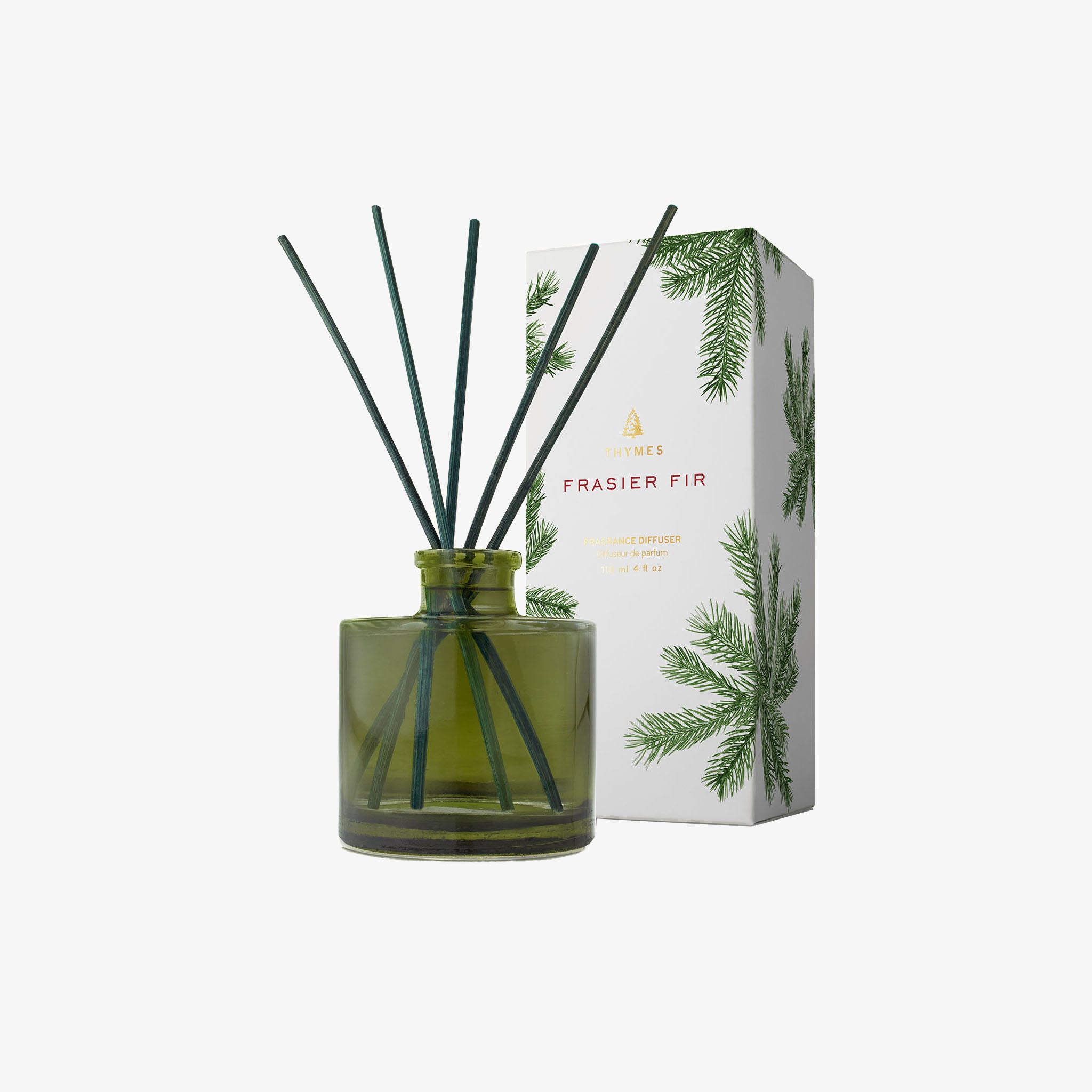 Frasier Fir diffuser by Thymes in green glass jar with green reeds and gift biox.