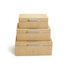 Three cane wrapped nesting boxes with silver handles stacked on a white background