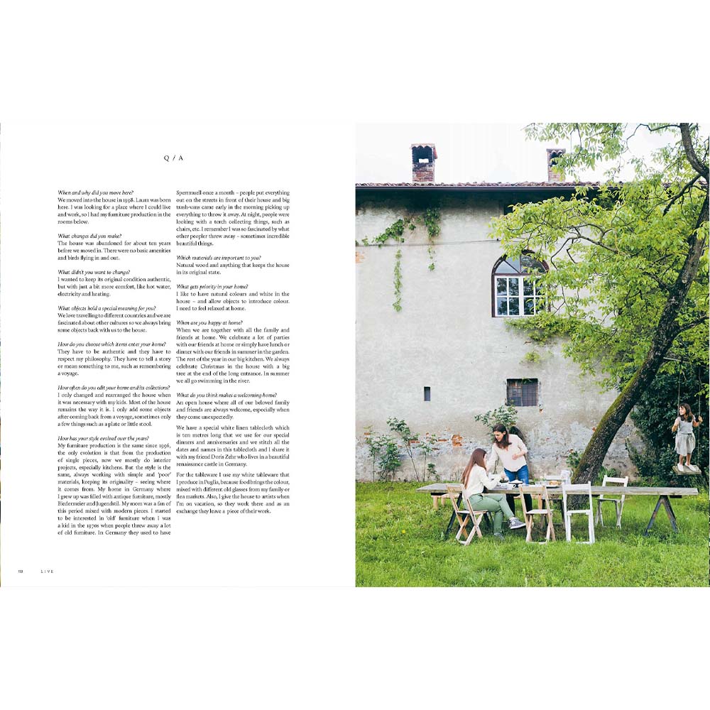 Photograph of two women sitting at an outdoor table with folding chairs from book 'This is Home:The Art of Simple Living'