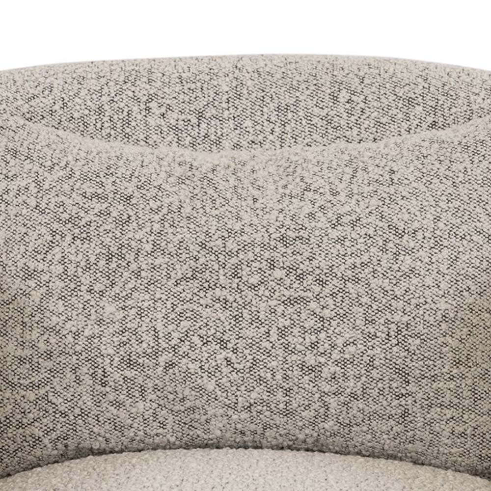 Close up of fabric on Four hands brand Topanga swivel chair with boucle grey and creme fabric on a white background