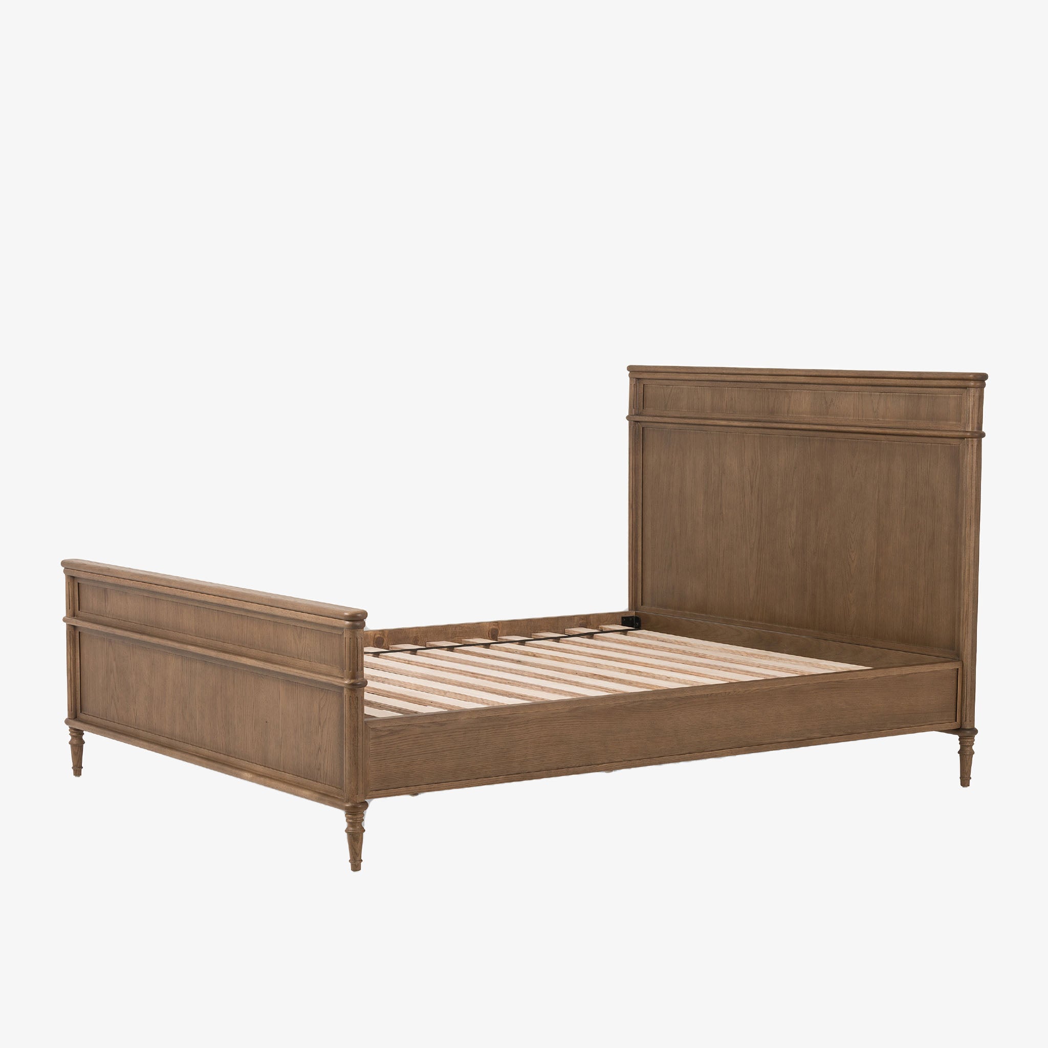 Wood 'Toulouse' bed with panels and spindle legs by Four hands furniture on a white background