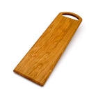 JK Adams long cherry serving board with rounded handle on a white background